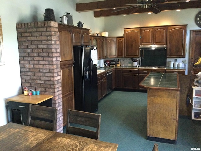 kitchen featuring tile countertops, beamed ceiling, dark brown cabinetry, appliances with stainless steel finishes, and dark colored carpet