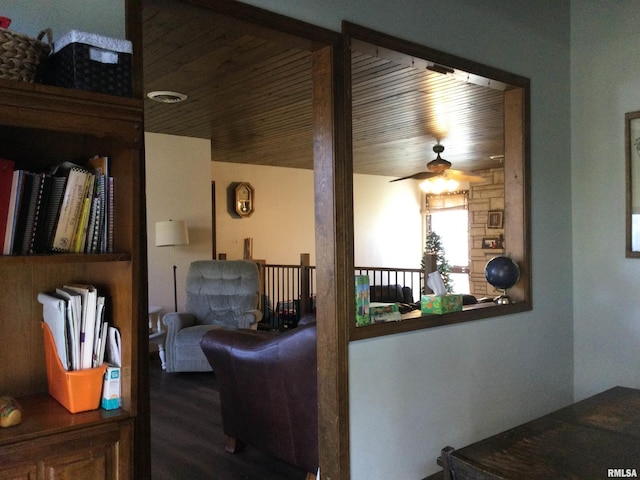 hall featuring wood-type flooring and wooden ceiling