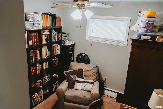 sitting room featuring carpet and ceiling fan