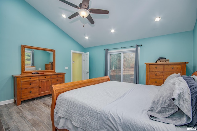 bedroom with access to exterior, ceiling fan, light hardwood / wood-style floors, and vaulted ceiling