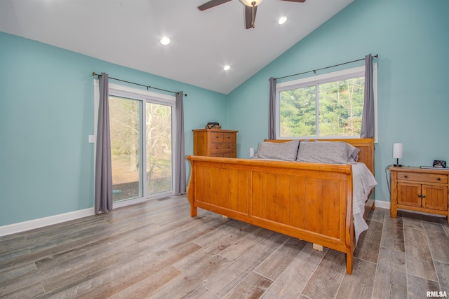 bedroom with ceiling fan, vaulted ceiling, light hardwood / wood-style floors, and multiple windows