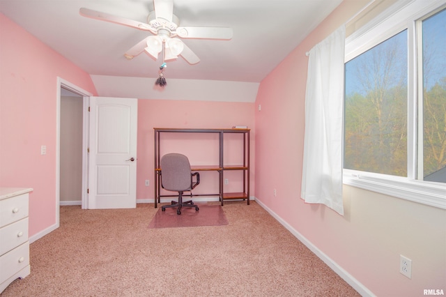 unfurnished office featuring light colored carpet, ceiling fan, and lofted ceiling