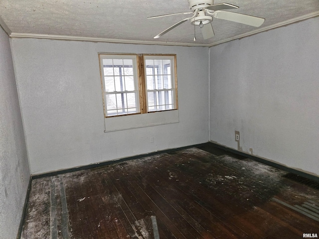 spare room with crown molding, ceiling fan, and dark wood-type flooring