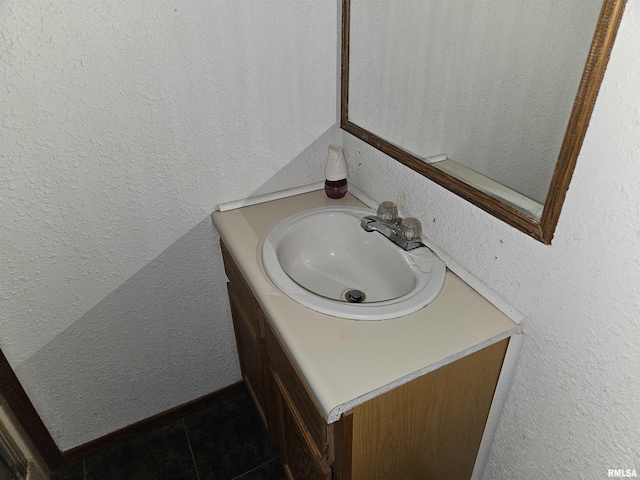 bathroom featuring tile patterned floors and vanity