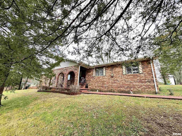 1807 E Saint Louis St, West Frankfort, IL 62896 - view of front of home featuring brick siding and a front lawn
