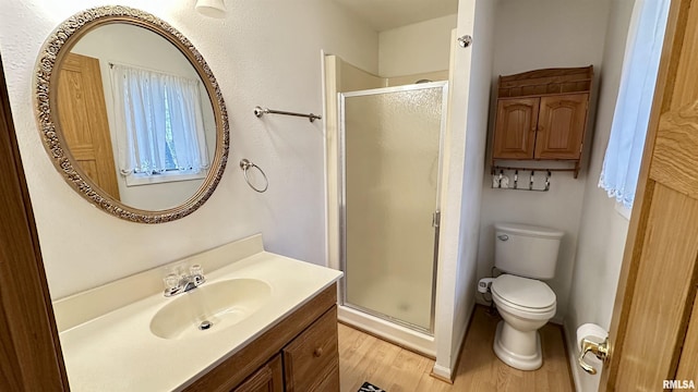 1807 E Saint Louis St, West Frankfort, IL 62896 - bathroom with vanity, wood finished floors, and a shower stall
