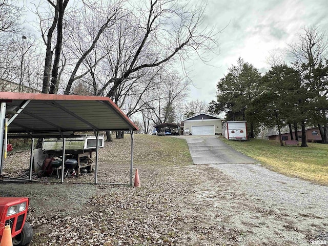 1807 E Saint Louis St, West Frankfort, IL 62896 - view of green lawn with a garage, driveway, and an outdoor structure