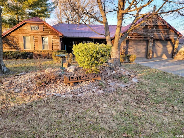 log home featuring a garage