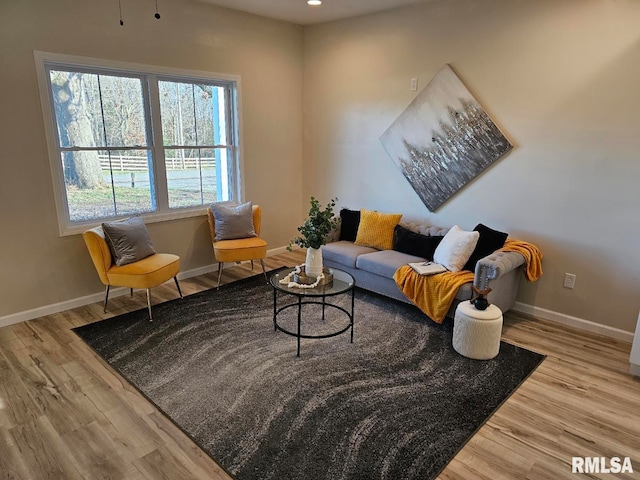 sitting room with recessed lighting, wood finished floors, and baseboards