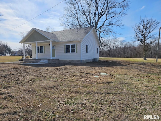 view of front of property with cooling unit and covered porch