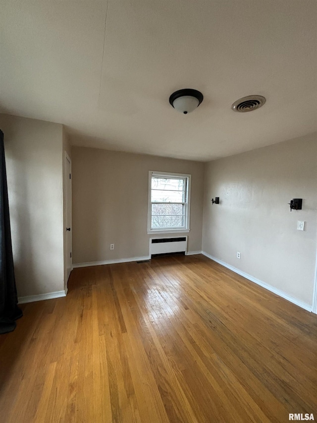 unfurnished room featuring light wood-type flooring