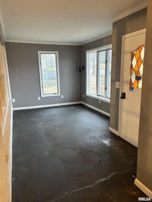 empty room featuring crown molding and a healthy amount of sunlight