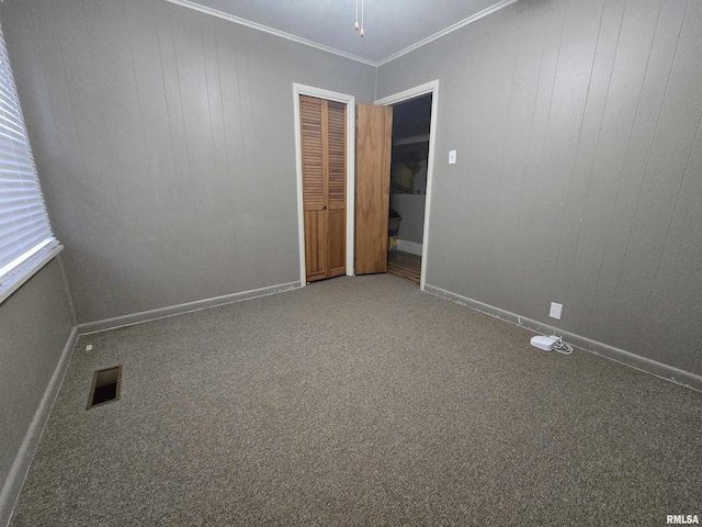 carpeted empty room with ornamental molding