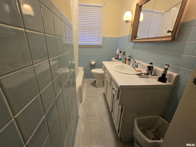 bathroom featuring tile patterned flooring, toilet, vanity, tile walls, and a shower with shower curtain