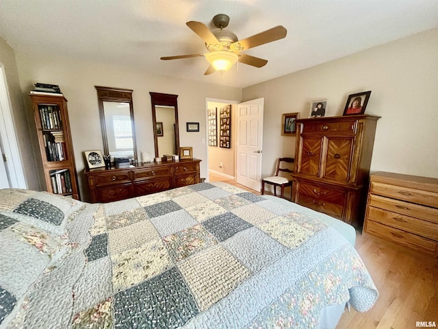 bedroom with ceiling fan and light wood-type flooring