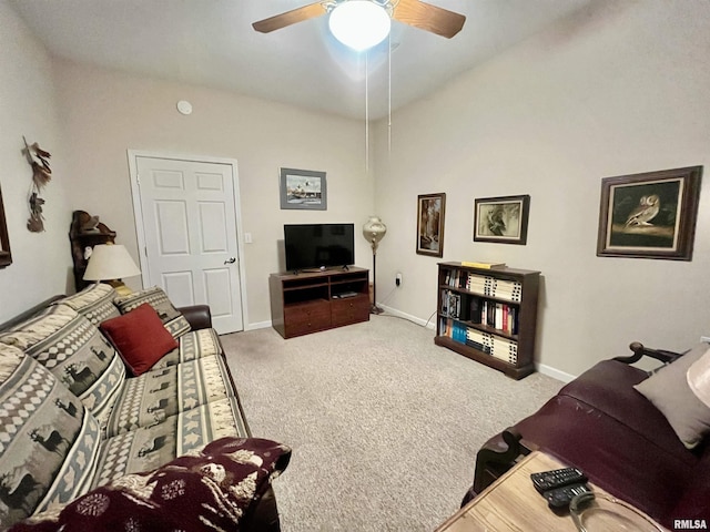 living room featuring carpet and ceiling fan