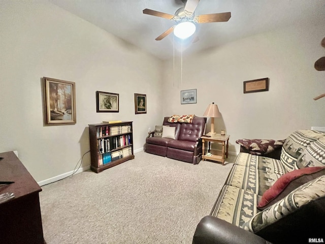 carpeted living room featuring ceiling fan