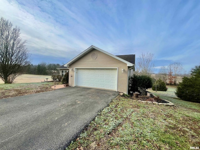 view of side of property with a garage