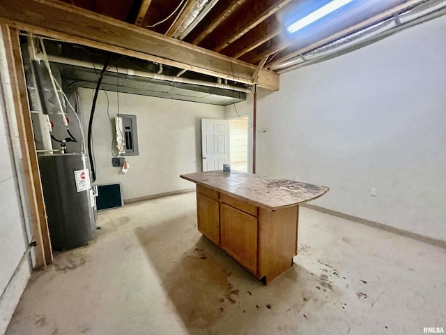 basement featuring electric water heater and electric panel