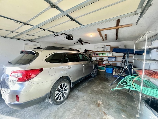 garage featuring ceiling fan and a garage door opener