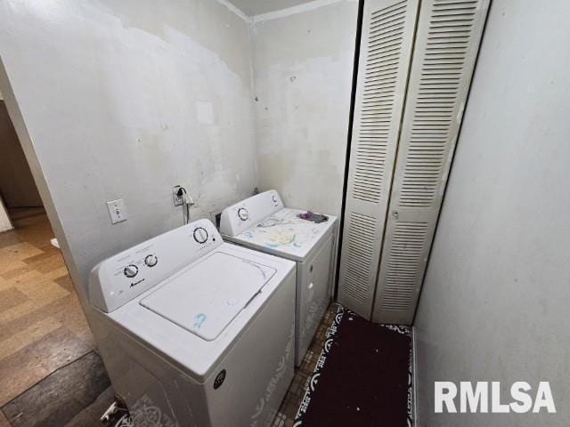 laundry area with washing machine and clothes dryer