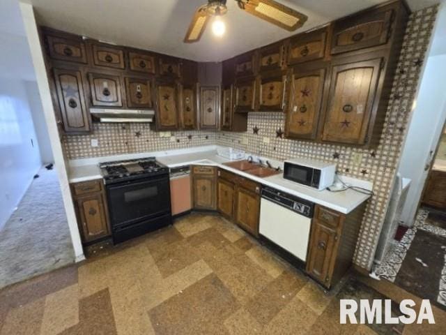 kitchen with white dishwasher, dark brown cabinets, sink, and black electric range