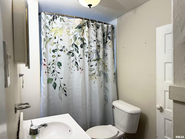 full bathroom with toilet and a sink