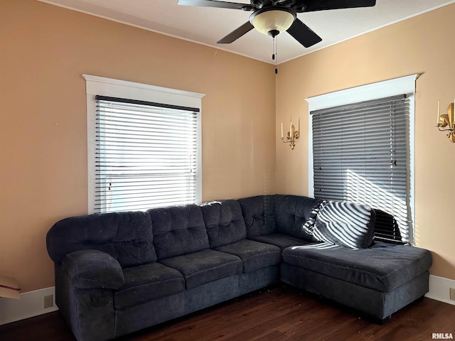 living room featuring dark wood-style floors and a ceiling fan