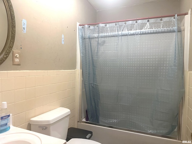 full bathroom featuring vanity, toilet, tile walls, and bathing tub / shower combination