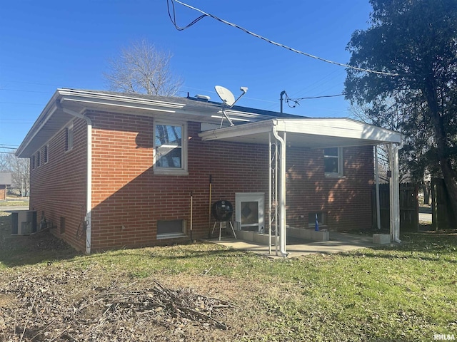 back of house with a patio, cooling unit, and a lawn