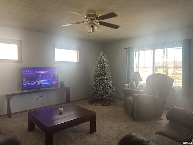 carpeted living room featuring ceiling fan