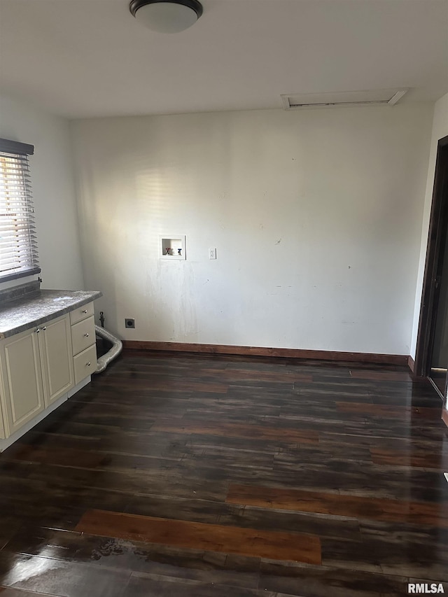 clothes washing area featuring dark wood finished floors, hookup for a washing machine, baseboards, and hookup for an electric dryer