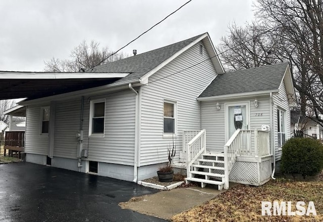 view of front of home featuring a carport