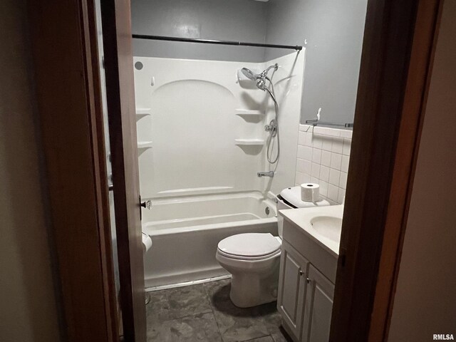 bathroom with tasteful backsplash, walk in shower, vanity, and toilet