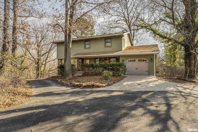 front of property with a porch and a garage