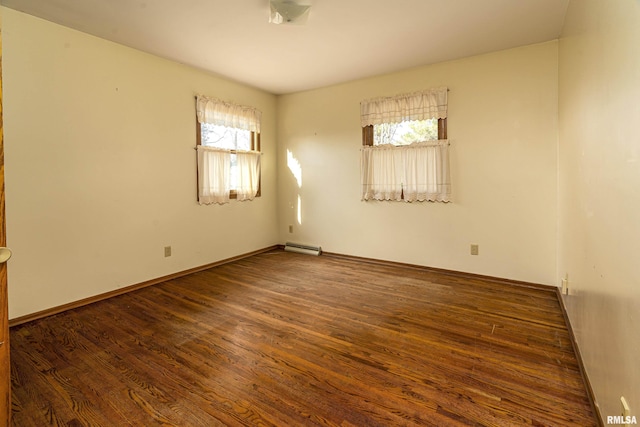 unfurnished room with a healthy amount of sunlight and dark hardwood / wood-style flooring