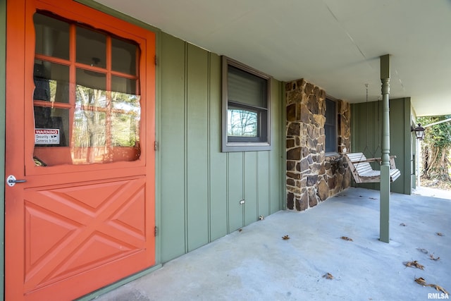 entrance to property with a porch