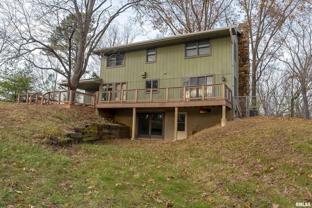 rear view of house featuring a deck