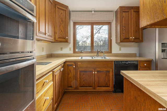 kitchen featuring appliances with stainless steel finishes and sink