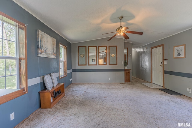 408 W Kirkwood St, Odin, IL 62870 - unfurnished living room featuring ceiling fan, vaulted ceiling, carpet flooring, and ornamental molding