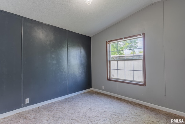 408 W Kirkwood St, Odin, IL 62870 - unfurnished room with lofted ceiling, a textured ceiling, carpet floors, and baseboards