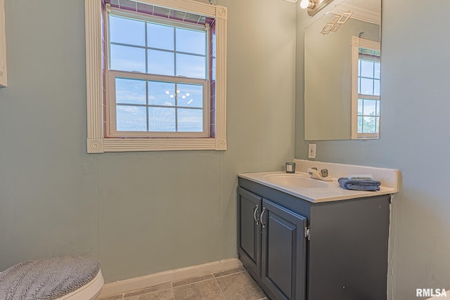 408 W Kirkwood St, Odin, IL 62870 - bathroom featuring baseboards, vanity, and toilet