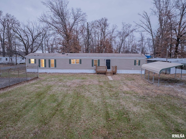 408 W Kirkwood St, Odin, IL 62870 - manufactured / mobile home featuring a carport and a front yard