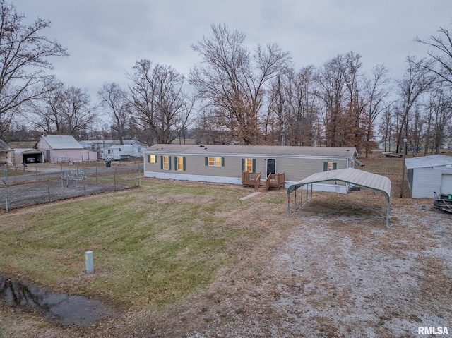 408 W Kirkwood St, Odin, IL 62870 - back of house featuring a carport