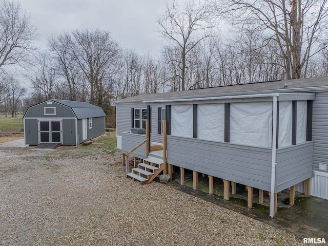 view of front facade with a shed