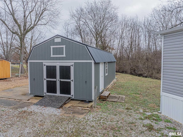 view of outdoor structure featuring a yard