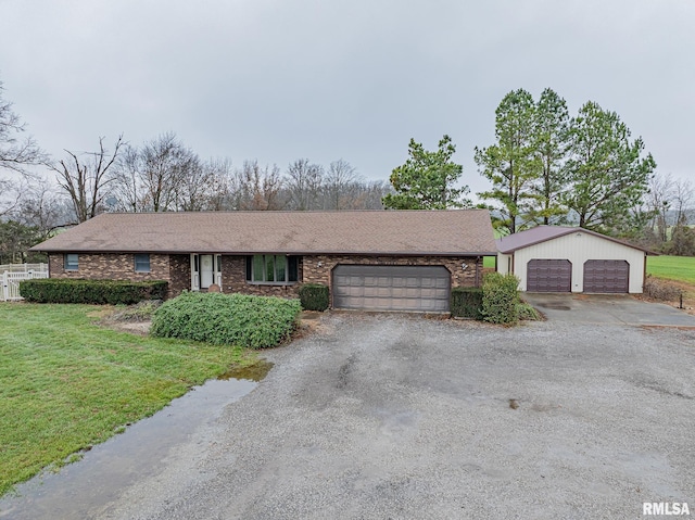 ranch-style house with a front yard and a garage