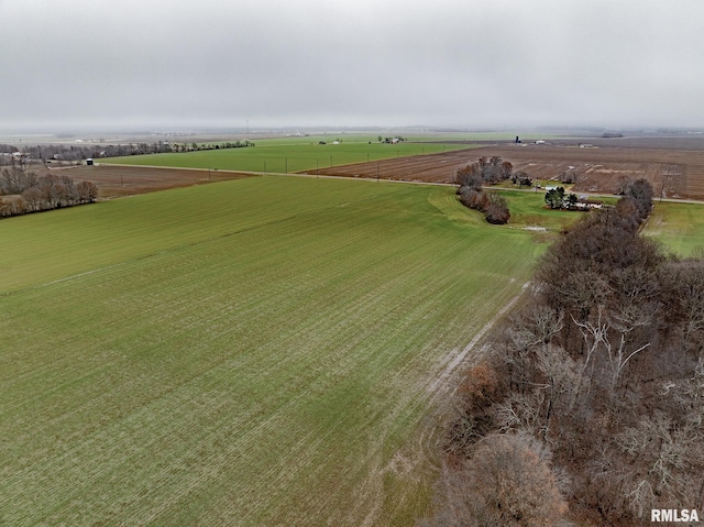 birds eye view of property with a rural view