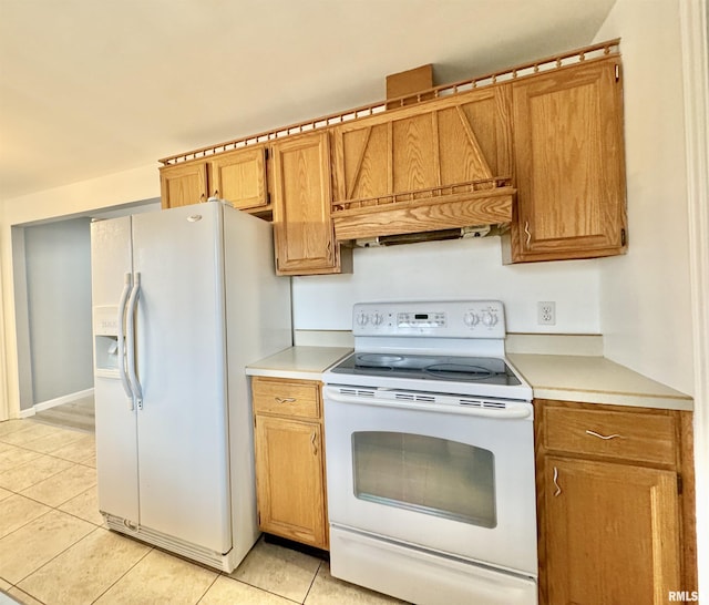 kitchen with custom exhaust hood, white appliances, and light tile patterned floors