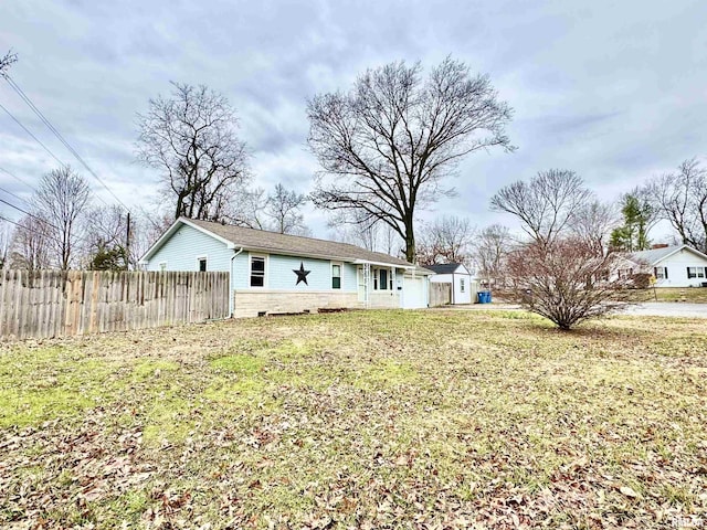 back of house featuring a lawn